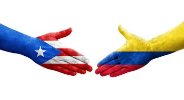 Kolombiya ve Porto Riko bayrakları arasındaki el sıkışma ellerinde izole şeffaf görüntü.