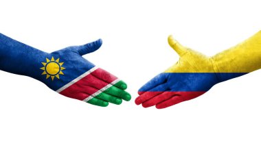 Ellerinde Kolombiya ve Namibya bayrakları arasında el sıkışma, izole şeffaf görüntü.