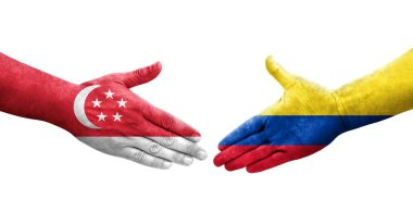Kolombiya ve Singapur bayrakları arasındaki el sıkışma ellerinde resmedilmiş şeffaf görüntü.