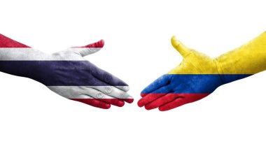 Ellerinde Kolombiya ve Tayland bayrakları arasında el sıkışma, izole şeffaf görüntü.