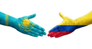 Kolombiya ve Kazakistan bayrakları arasındaki el sıkışma ellerinde izole şeffaf görüntü.