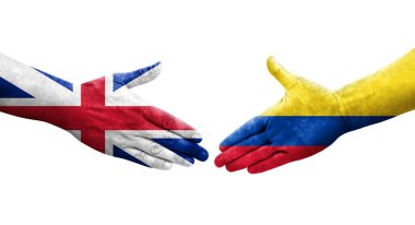Kolombiya ve Büyük Britanya bayrakları arasındaki el sıkışma ellerinde resmedilmiş şeffaf bir görüntü.