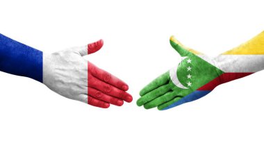 Comoros ve Fransa bayrakları arasındaki el sıkışma ellerinde resmedilmiş şeffaf görüntü.