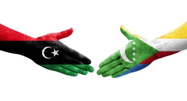 Ellerinde Comoros ve Libya bayrakları arasında el sıkışma, izole şeffaf görüntü.