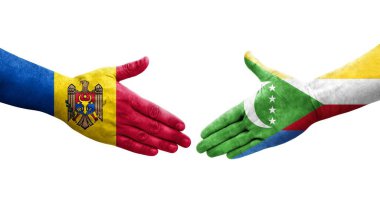 Ellerine boyanmış Comoros ve Moldova bayrakları arasındaki el sıkışma, izole şeffaf görüntü.
