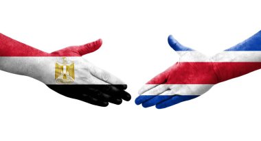 Ellerinde Kosta Rika ve Mısır bayrakları arasında el sıkışma, izole şeffaf görüntü.