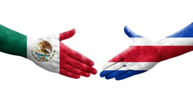 Ellerinde Kosta Rika ve Meksika bayrakları arasında el sıkışma, izole şeffaf görüntü.