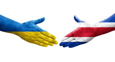 Ellerinde Kosta Rika ve Ukrayna bayrakları arasında el sıkışma, izole şeffaf görüntü.