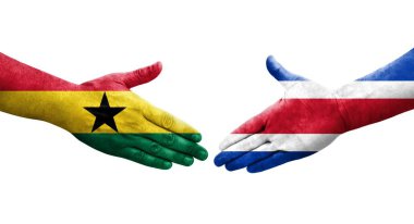 Ellerinde Kosta Rika ve Gana bayrakları arasında el sıkışma, izole şeffaf görüntü.