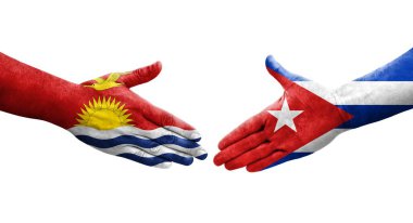 Ellerinde Küba ve Kiribati bayrakları arasında el sıkışma, izole şeffaf görüntü.
