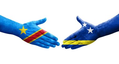 Curacao ve Dr. Kongo bayrakları arasındaki el sıkışma ellerinde izole şeffaf görüntü.