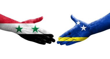 Curacao ve Suriye bayrakları arasındaki el sıkışma, izole şeffaf görüntü.