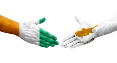 Kıbrıs Rum Kesimi ile Fildişi Sahil Bayrakları arasındaki el sıkışma, izole saydam görüntü.