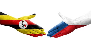 Çek ve Uganda bayrakları arasındaki tokalaşma elleri boyalı, izole şeffaf görüntü.