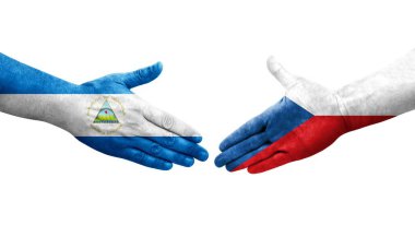 Çek ve Nikaragua bayrakları arasındaki el sıkışma ellerinde izole şeffaf görüntü.