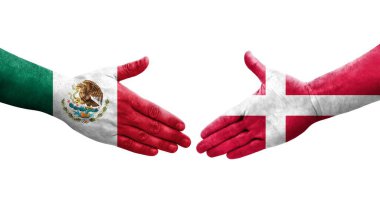 Ellerinde Danimarka ve Meksika bayrakları arasında el sıkışma, izole şeffaf görüntü.