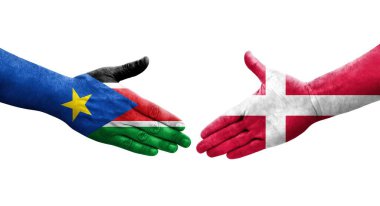 Danimarka ve Güney Sudan bayrakları arasında el sıkışma, izole şeffaf görüntü.