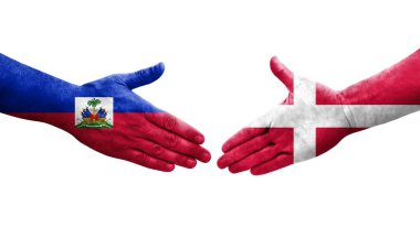 Danimarka ve Haiti bayrakları arasındaki el sıkışma, izole şeffaf görüntü.