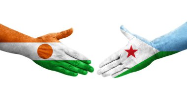 Cibuti ve Nijer bayrakları arasındaki el sıkışma ellerinde izole şeffaf görüntü.