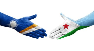 Cibuti ve Marshall Adaları arasındaki el sıkışma ellerinde boyanmış bayraklar, izole şeffaf görüntü.