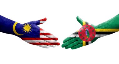 Dominika ile Malezya bayrakları arasındaki el sıkışma, izole şeffaf görüntü.