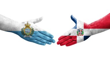 Dominik Cumhuriyeti ve San Marino bayrakları arasındaki el sıkışma..