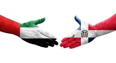 Dominik Cumhuriyeti ile BAE bayrakları arasındaki el sıkışma, izole şeffaf görüntü.