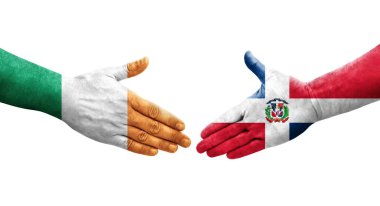 Dominik Cumhuriyeti ve İrlanda bayrakları arasındaki el sıkışma, izole şeffaf görüntü.