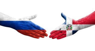 Dominik Cumhuriyeti ve Rusya bayrakları arasındaki el sıkışma, izole şeffaf görüntü.