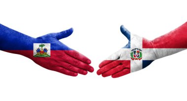 Dominik Cumhuriyeti ve Haiti bayrakları arasındaki el sıkışma, izole şeffaf görüntü.
