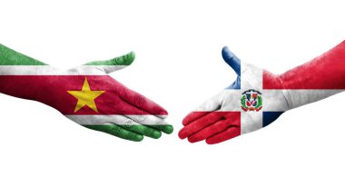 Dominik Cumhuriyeti ile Surinam bayrakları arasındaki el sıkışma, izole şeffaf görüntü.