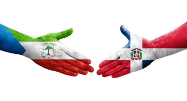 Dominik Cumhuriyeti ve Ekvator Gine bayrakları arasındaki el sıkışma, izole şeffaf görüntü.