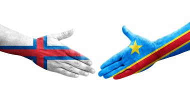 Dr Kongo ve Faroe Adaları bayrakları arasındaki el sıkışma ellerinde izole şeffaf görüntü.