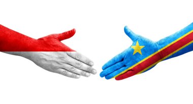 Dr Kongo ve Endonezya bayrakları arasındaki el sıkışma ellerinde izole şeffaf görüntü.