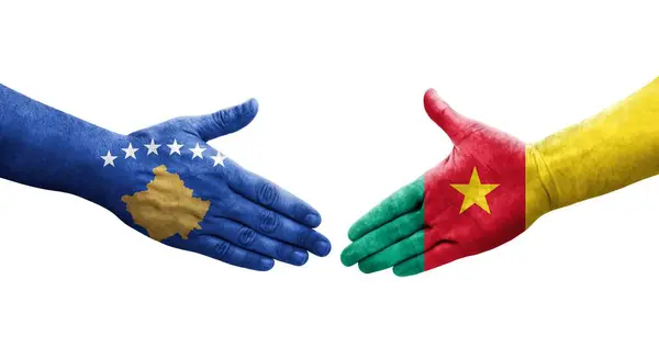 stock image Handshake between Cameroon and Kosovo flags painted on hands, isolated transparent image.