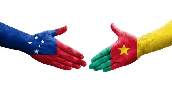 stock image Handshake between Cameroon and Samoa flags painted on hands, isolated transparent image.