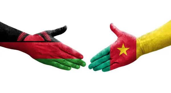 stock image Handshake between Cameroon and Malawi flags painted on hands, isolated transparent image.