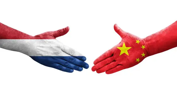 stock image Handshake between China and Netherlands flags painted on hands, isolated transparent image.