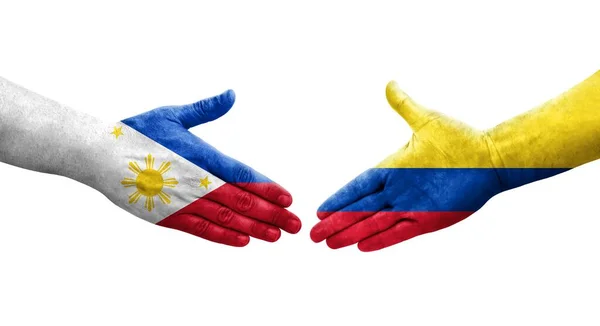 手に描かれたコロンビアとフィリピンの旗の間の握手 隔離された透明画像 — ストック写真