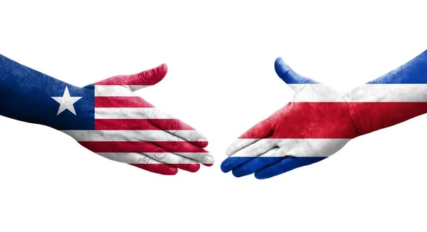Händedruck Zwischen Flaggen Costa Ricas Und Liberias Auf Hände Gemalt — Stockfoto