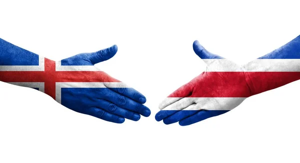 哥斯达黎加和冰岛之间的握手手绘国旗 孤立透明的图像 — 图库照片