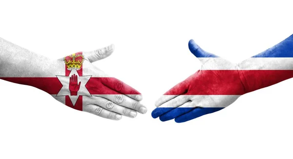 哥斯达黎加和北爱尔兰国旗之间的握手 孤立透明的图像 — 图库照片