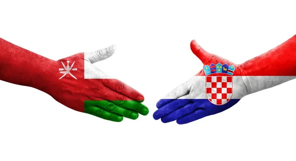 Stretta Mano Tra Croazia Oman Bandiere Dipinte Mani Isolata Immagine — Foto Stock