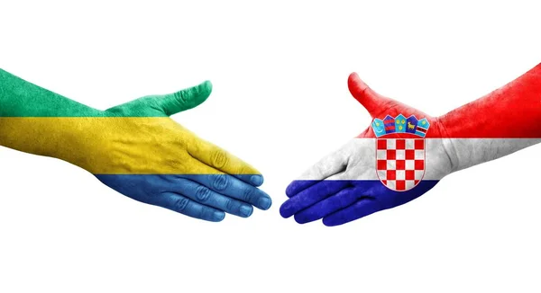 Stretta Mano Tra Croazia Gabon Bandiere Dipinte Mani Isolata Immagine — Foto Stock
