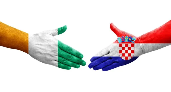 Uścisk Dłoni Między Chorwacją Wybrzeżem Kości Słoniowej Flagi Malowane Rękach — Zdjęcie stockowe