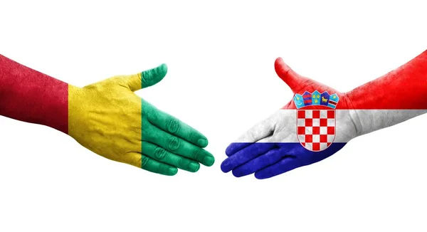 Handslag Mellan Kroatien Och Guinea Flaggor Målade Händer Isolerad Transparent — Stockfoto