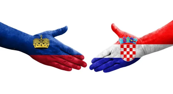 Handslag Mellan Kroatien Och Liechtenstein Flaggor Målade Händer Isolerad Transparent — Stockfoto