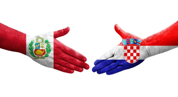 手に描かれたクロアチアとペルーの旗の間の握手 孤立した透明なイメージ — ストック写真
