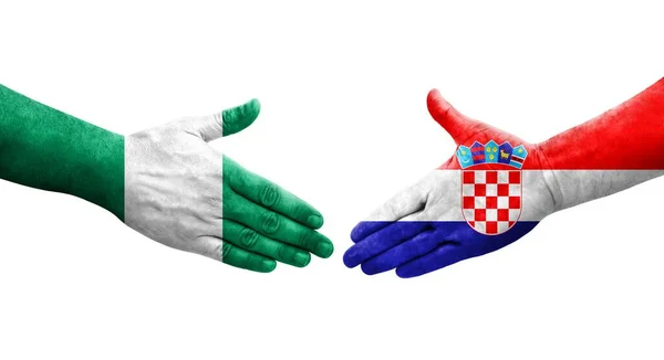 Handshake Entre Croácia Nigéria Bandeiras Pintadas Mãos Imagem Transparente Isolada — Fotografia de Stock