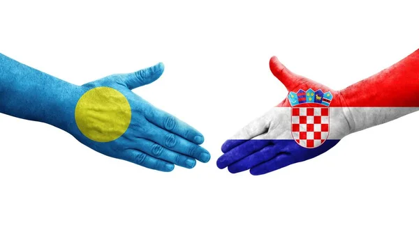 Uścisk Dłoni Między Chorwacją Palau Flagi Malowane Rękach Odizolowany Przezroczysty — Zdjęcie stockowe